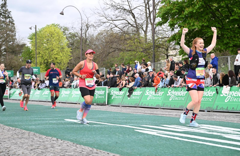 Finishing Paris Marathon in my happystride shorts, raising thousands for Cancer Research UK.